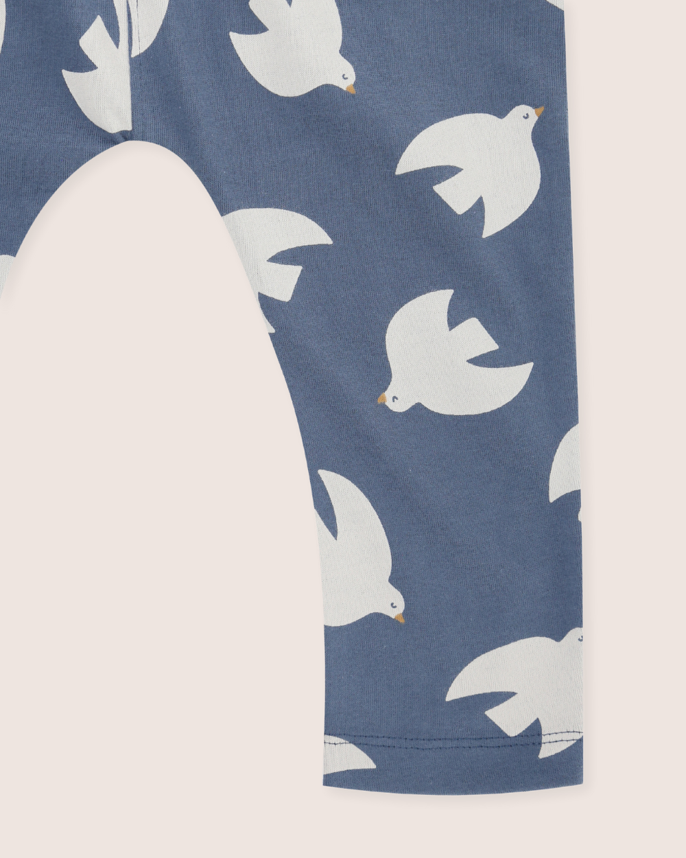 Navy blue dungaree leg with white dove pattern