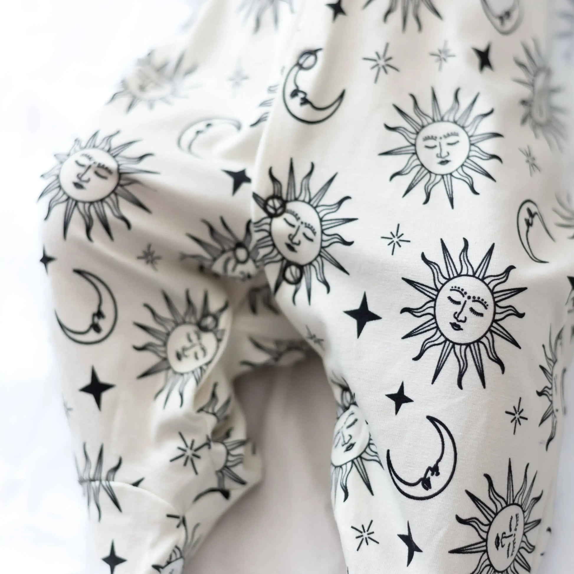 White fabric with black sun and moon pattern