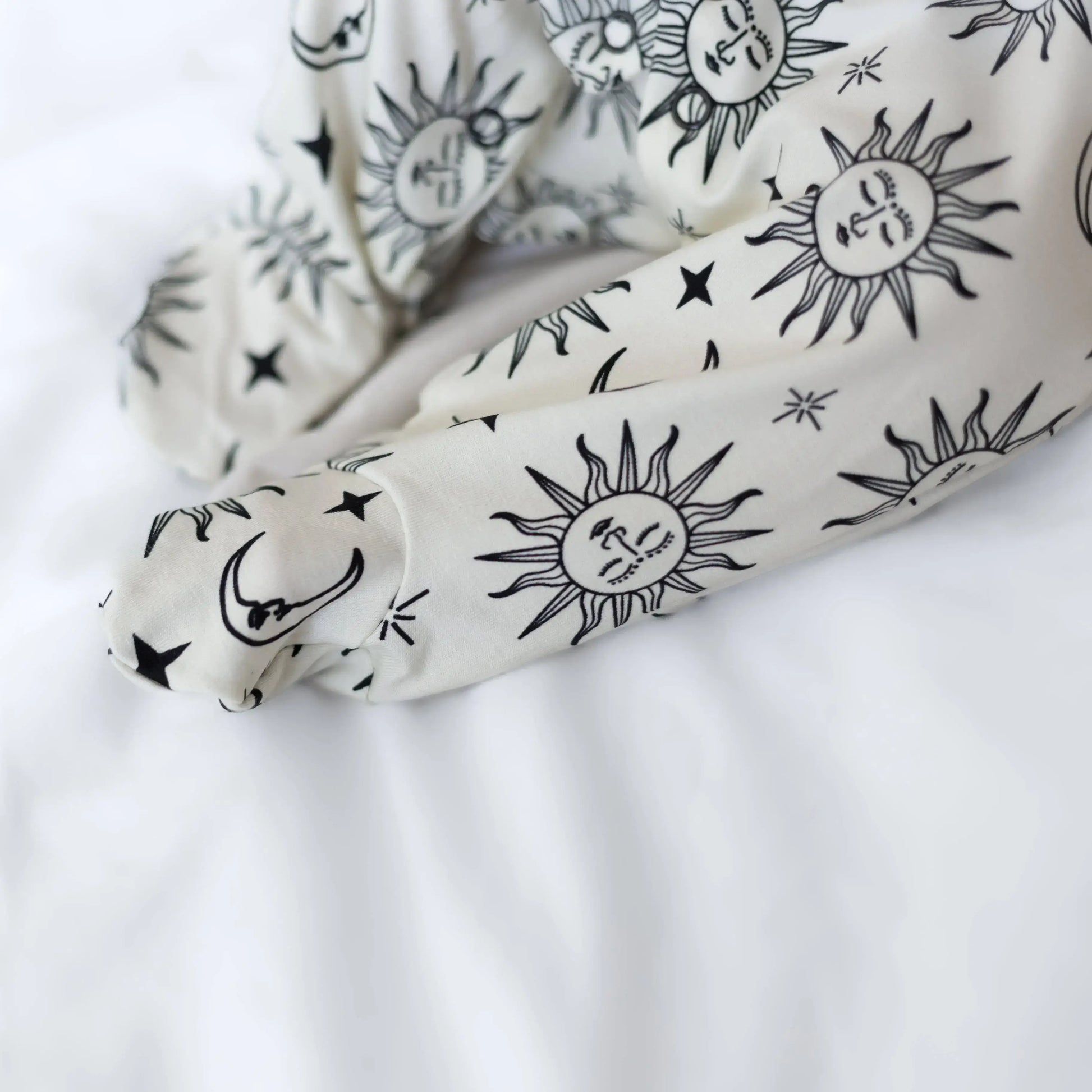 White with black celestial pattern on a white background