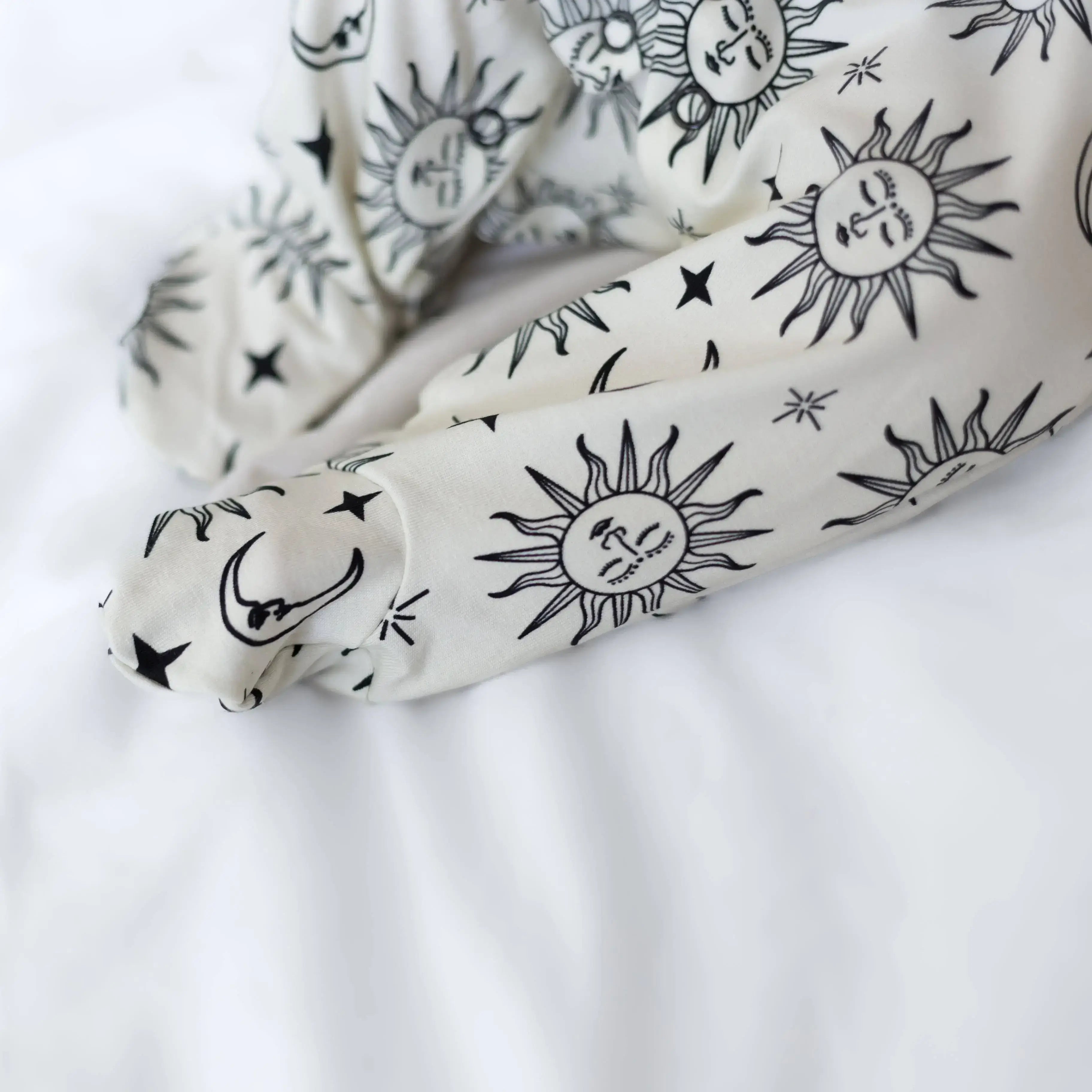 White with black celestial pattern on a white background