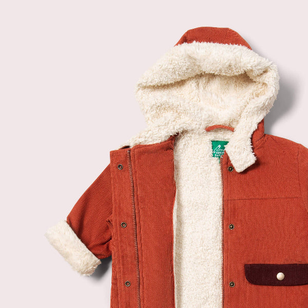 Red jacket with white fur lining on a light gray background