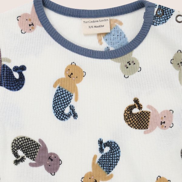 Baby outfit with mermaid-themed design on a white background