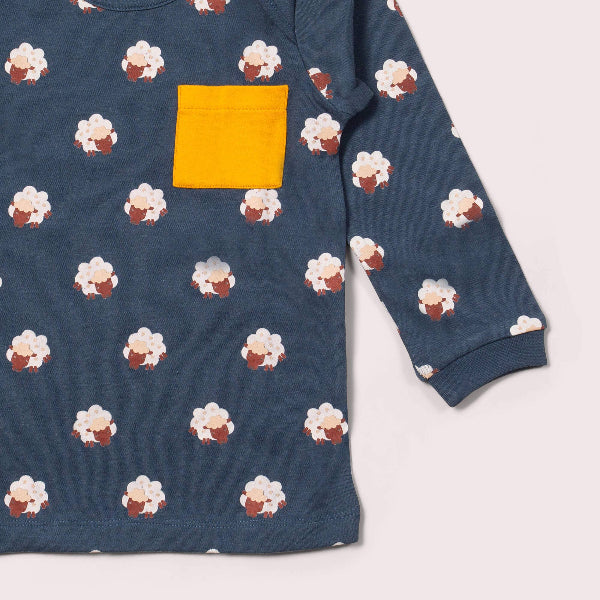 Blue sweatshirt with cupcake pattern and yellow pocket on a white background
