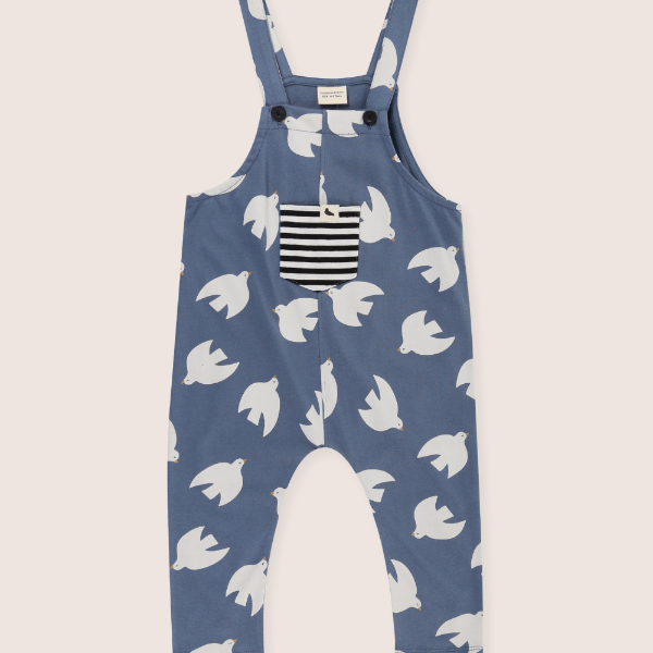 Blue dungaree with white bird pattern on a white background