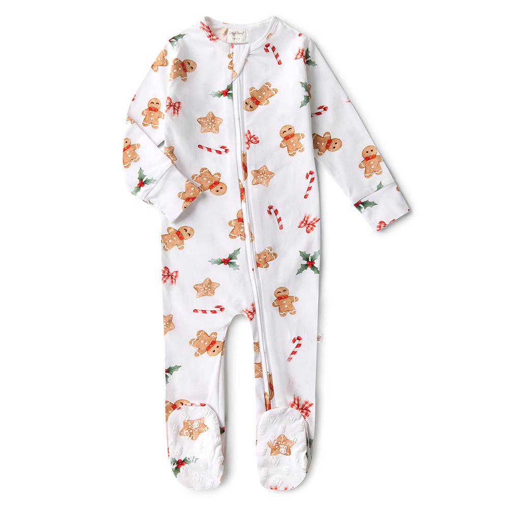 Baby onesie with gingerbread man and candy cane pattern on a white background