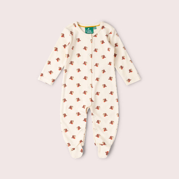 Baby onesie with fish pattern on a light gray background