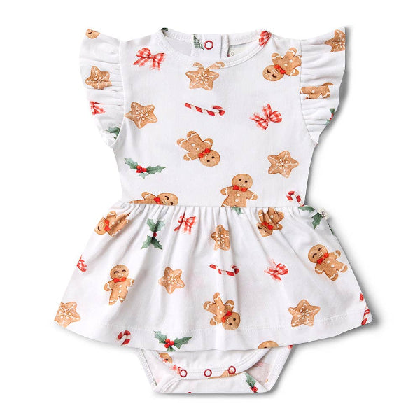Baby dress with Christmas-themed gingerbread pattern on a white background