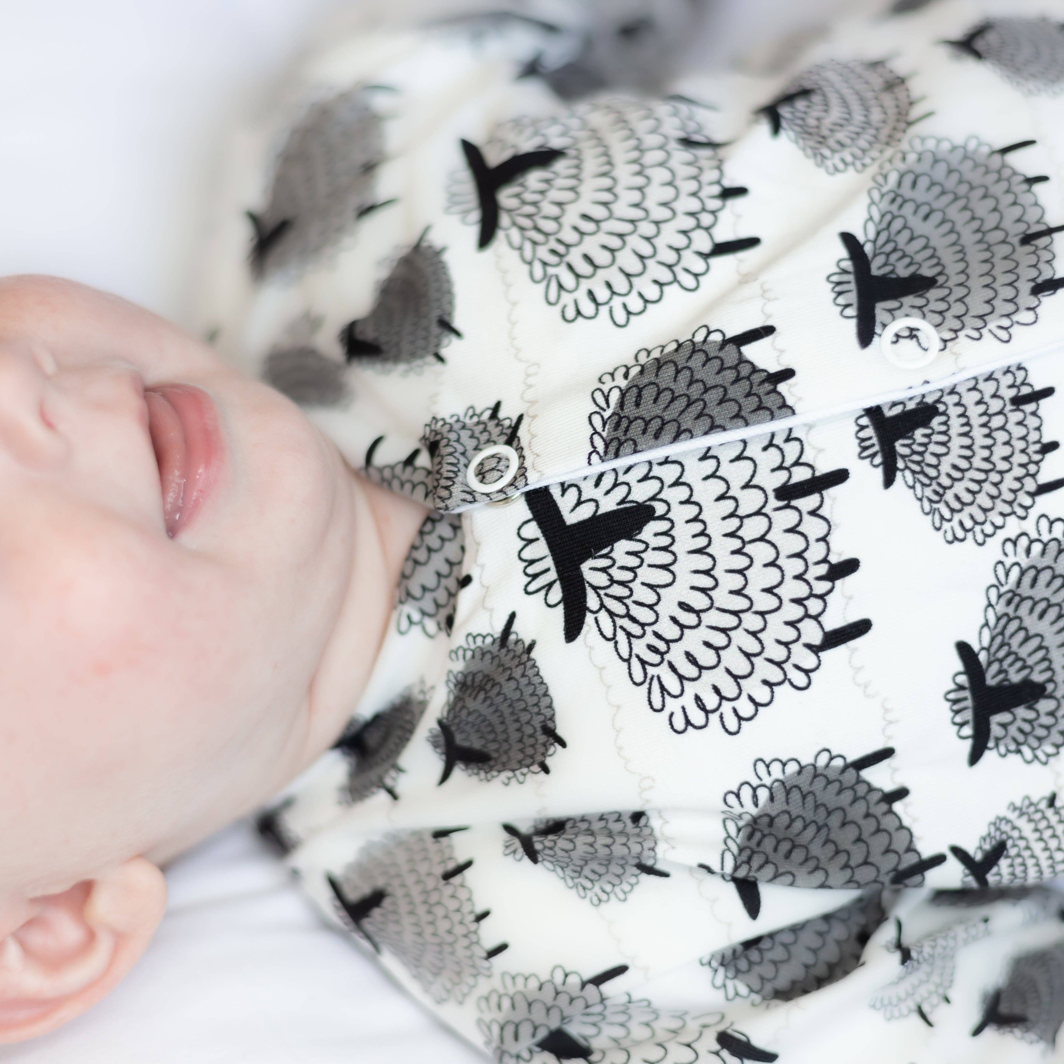 Close look up of detailed baby sleepsuit front