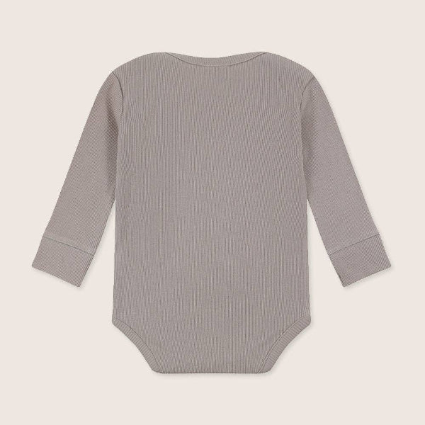 Gray ribbed baby bodysuit on a light beige background