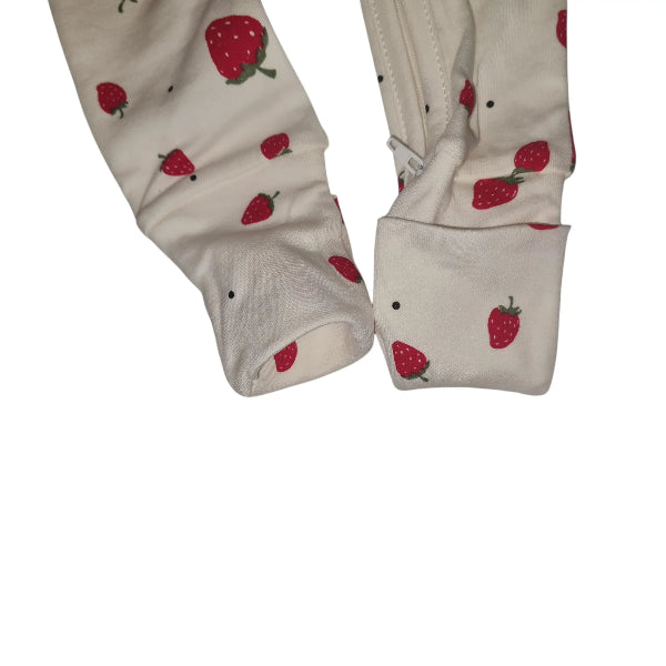 White cotton babygrow with red strawberry print on a white background