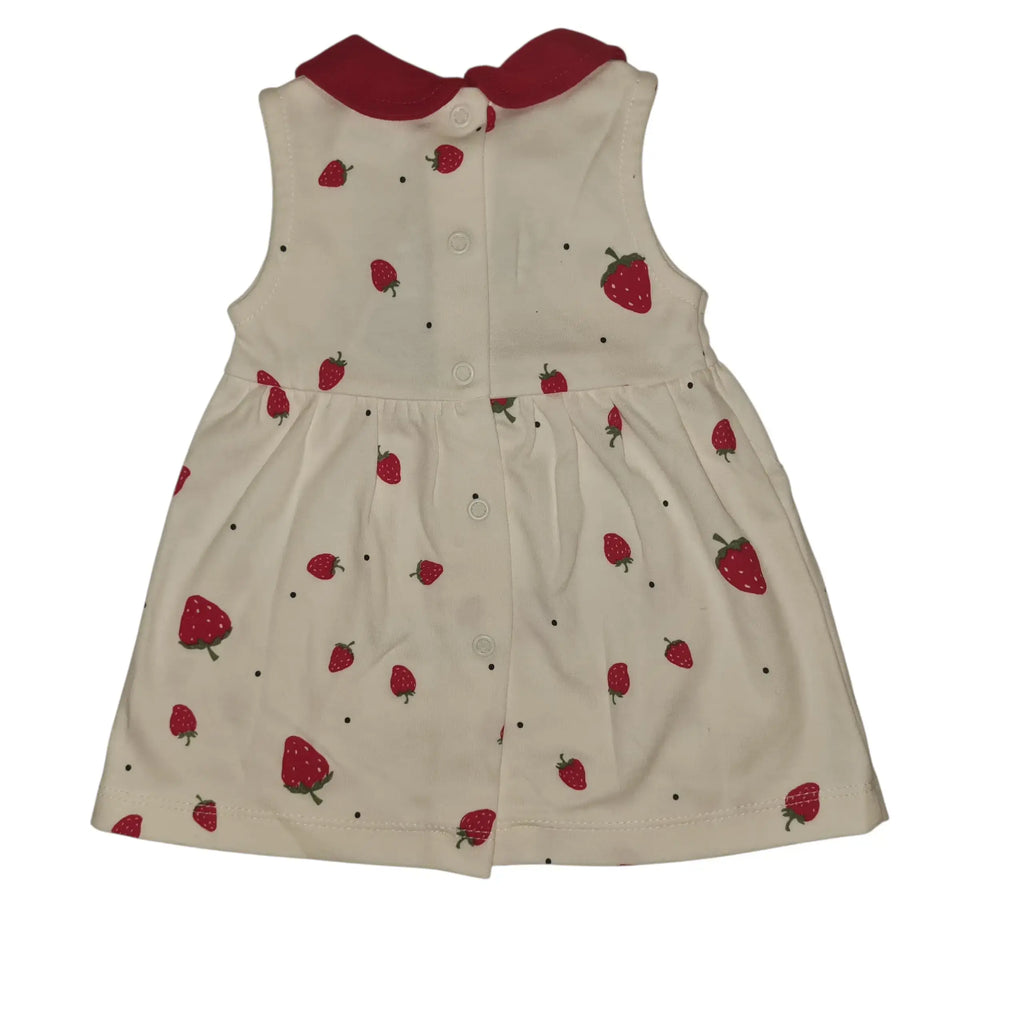 Full back view of white cotton baby dress with red collar, strawberry print, and snap button fastening, on a white background