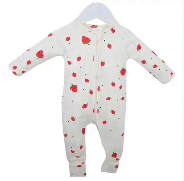 White cotton baby grow with red strawberry print, displayed on a hanger against a white background. Cotton Baby produc