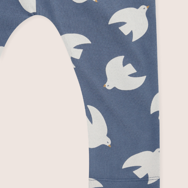 Navy blue dungaree leg with white dove pattern