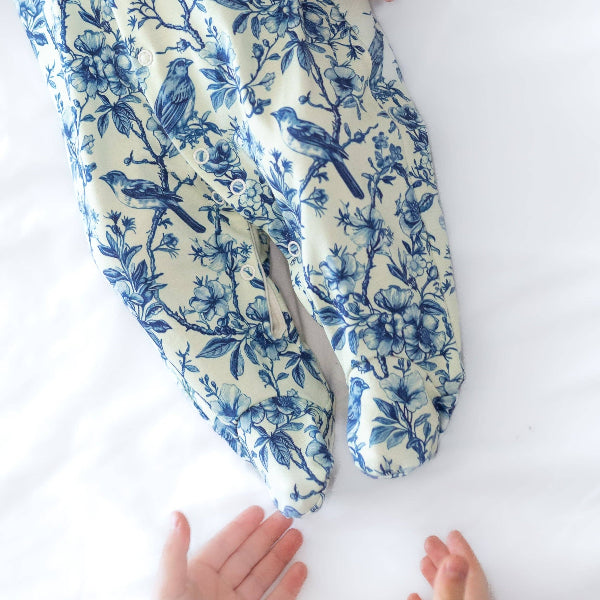 Pair of blue floral-patterned socks on a white background