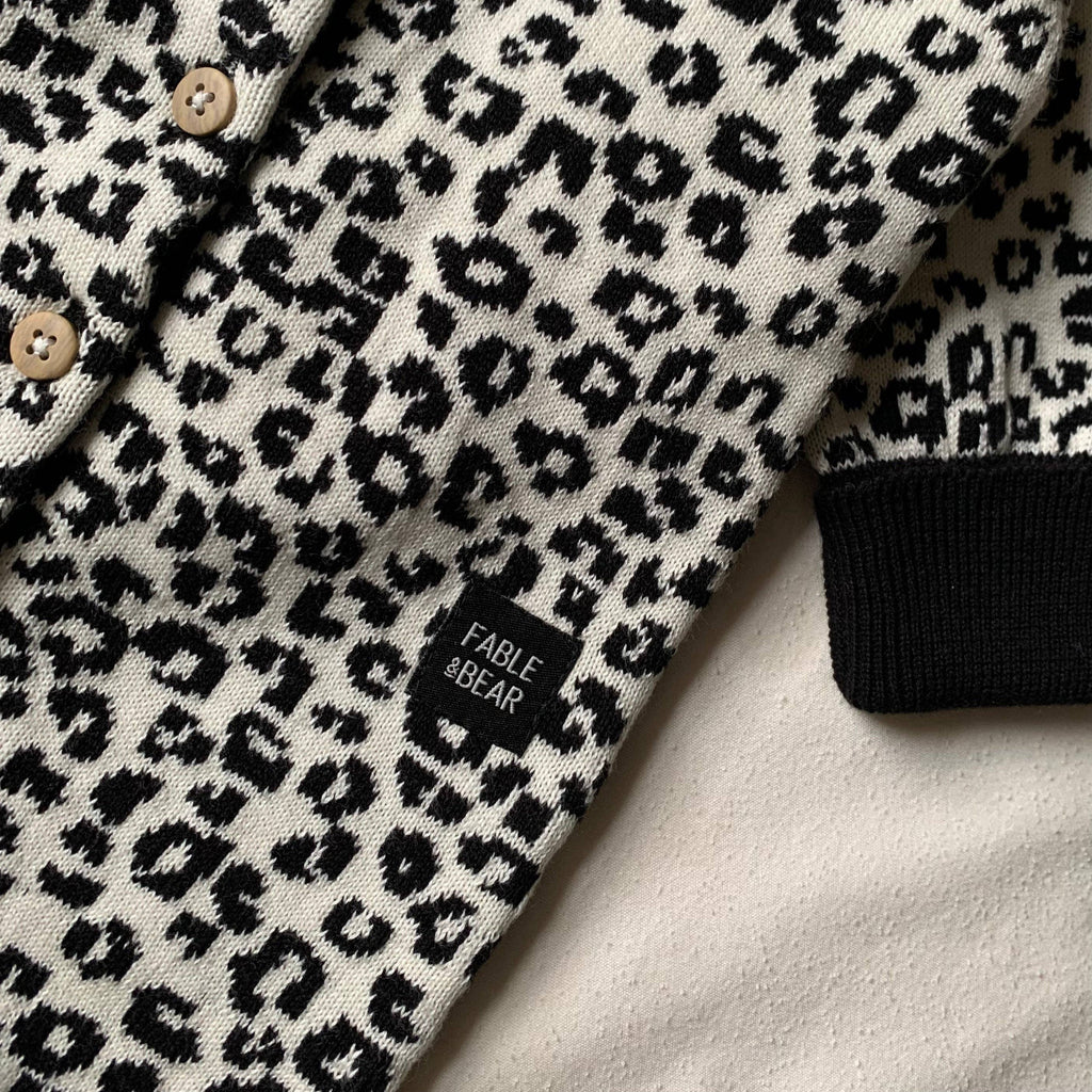 Leopard print romper with 'Fable & Bear' label on a light background