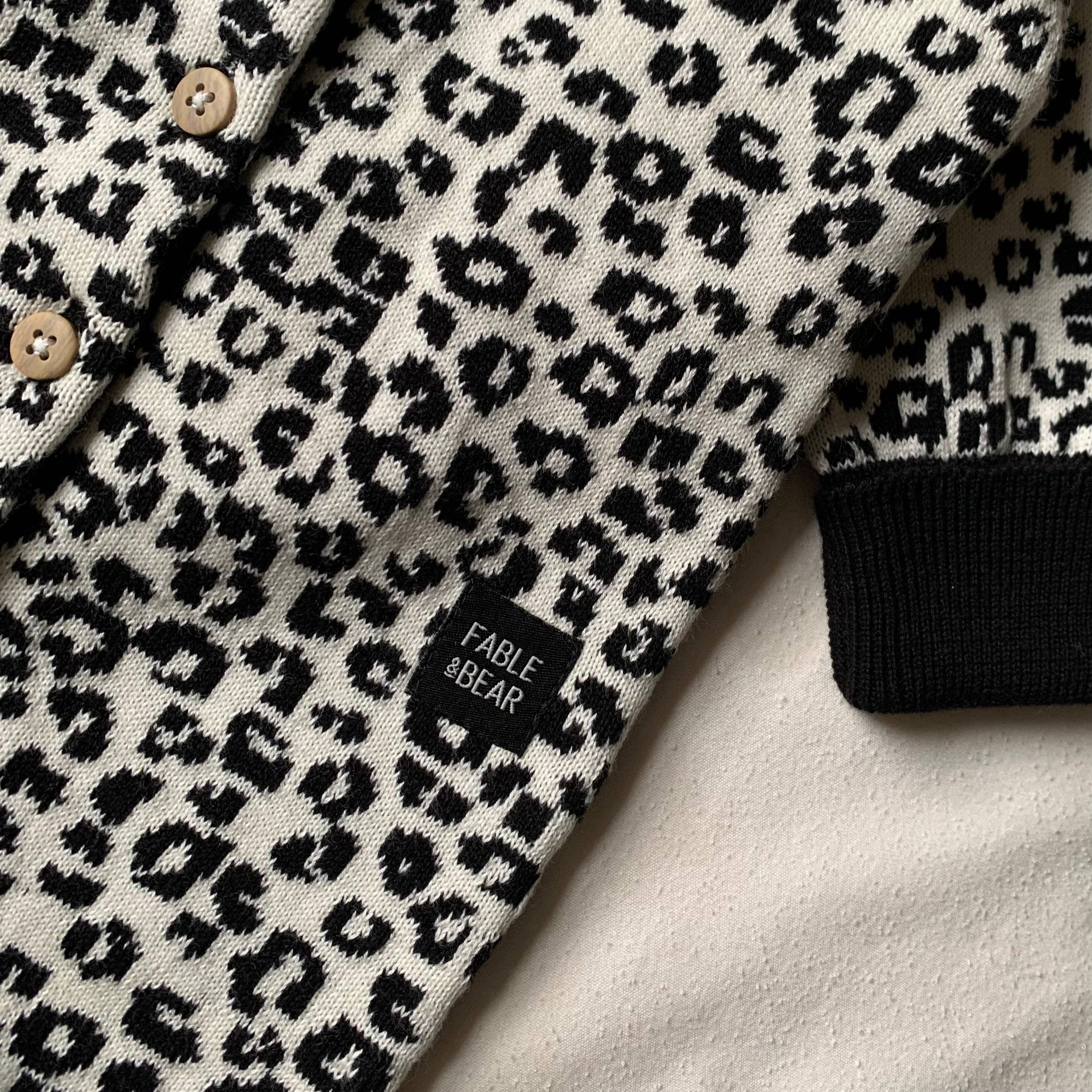 Leopard print romper with 'Fable & Bear' label on a light background