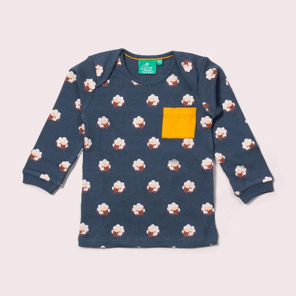 Children's long-sleeve shirt with cupcake pattern and yellow pocket on a light gray background
