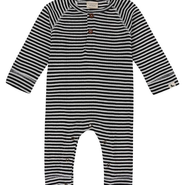Black and white striped baby playsuit on a white background