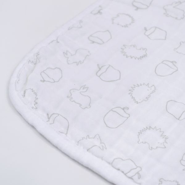 White fabric with embroidered patterns on a white background