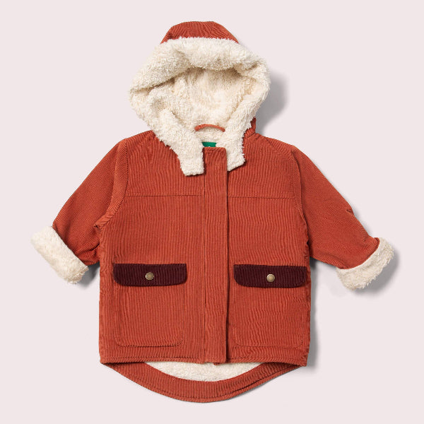 Red children's coat with white fur lining on a light gray background