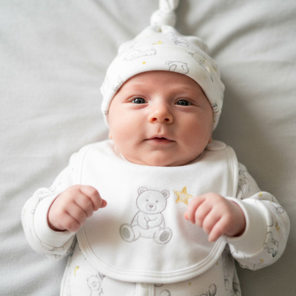 Baby wearing a hat nad bib