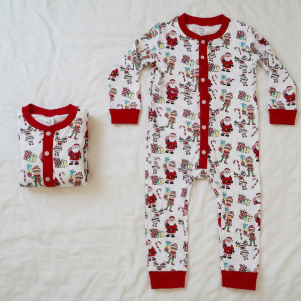 Set of Christmas-themed pajamas for adults and children on a white background
