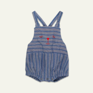 Blue striped baby romper with crisscross straps and a small red bear-face embroidery on the chest, snaps at the bottom.